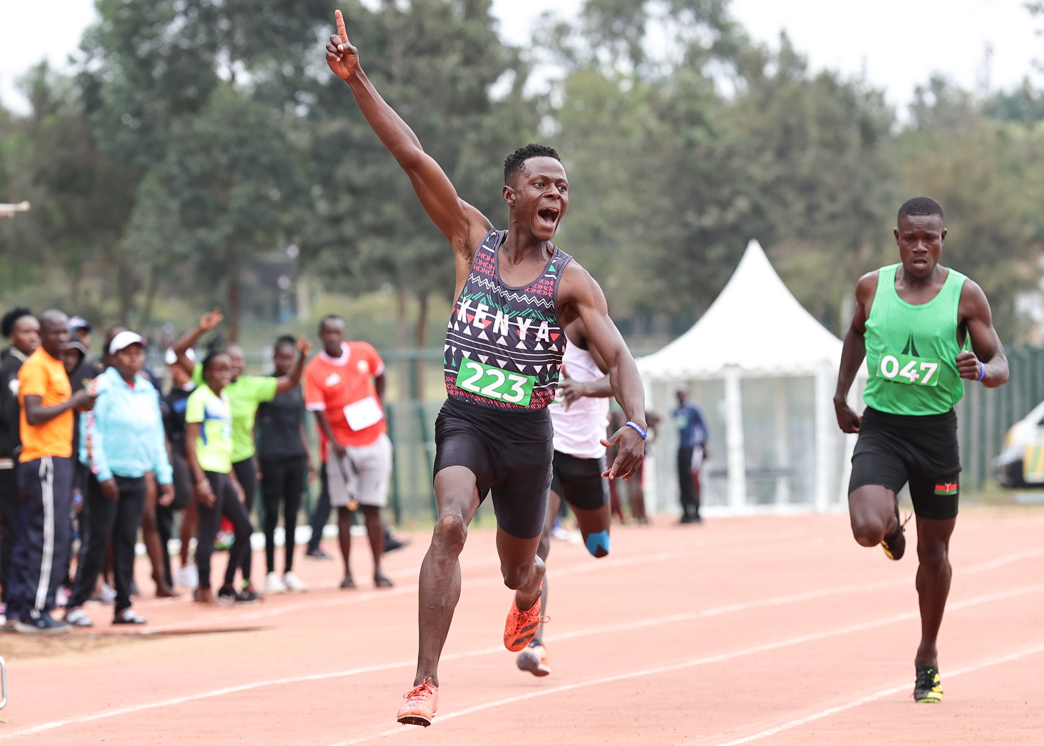 Athlete crossing finish line